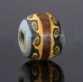 Ancient mosaic glass bead with classical wave pattern